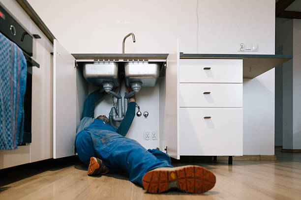 Professional Emergency Plumber technician working in Ursa, IL